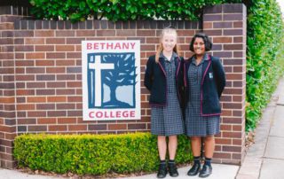 Bethany College Hurstville students standing in front of school gate